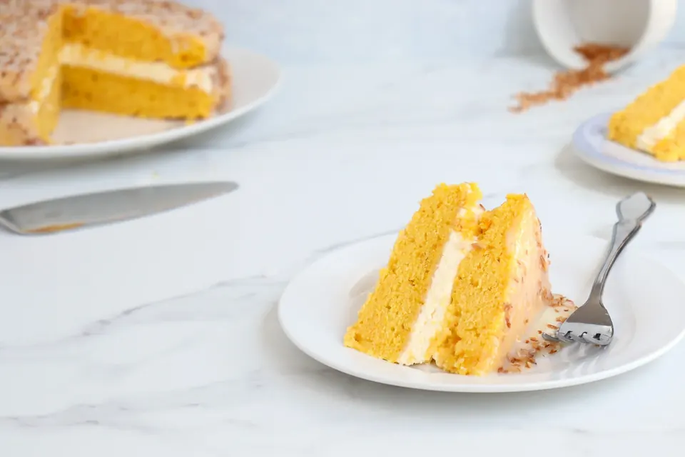 pumpkin coconut cake sliced on a plate