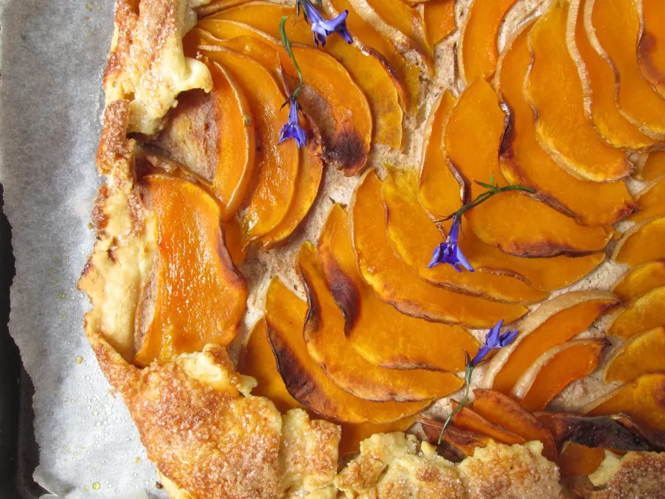 Pumpkin and ricotta galette topped with sliced roasted squash